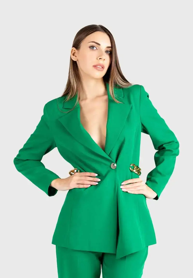 Women's suit consisting of a blazer, pants and gold chains on the sides