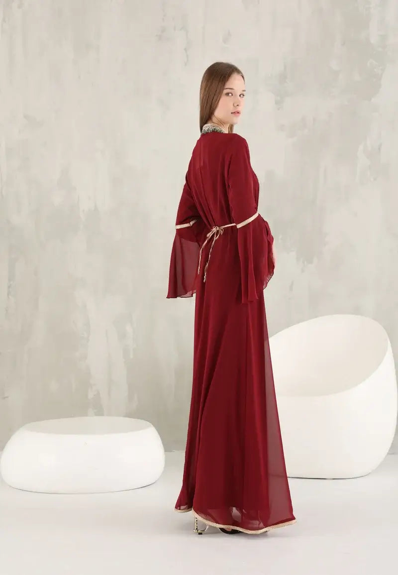 Dark red Moroccan women's caftan decorated with shiny colored crystals