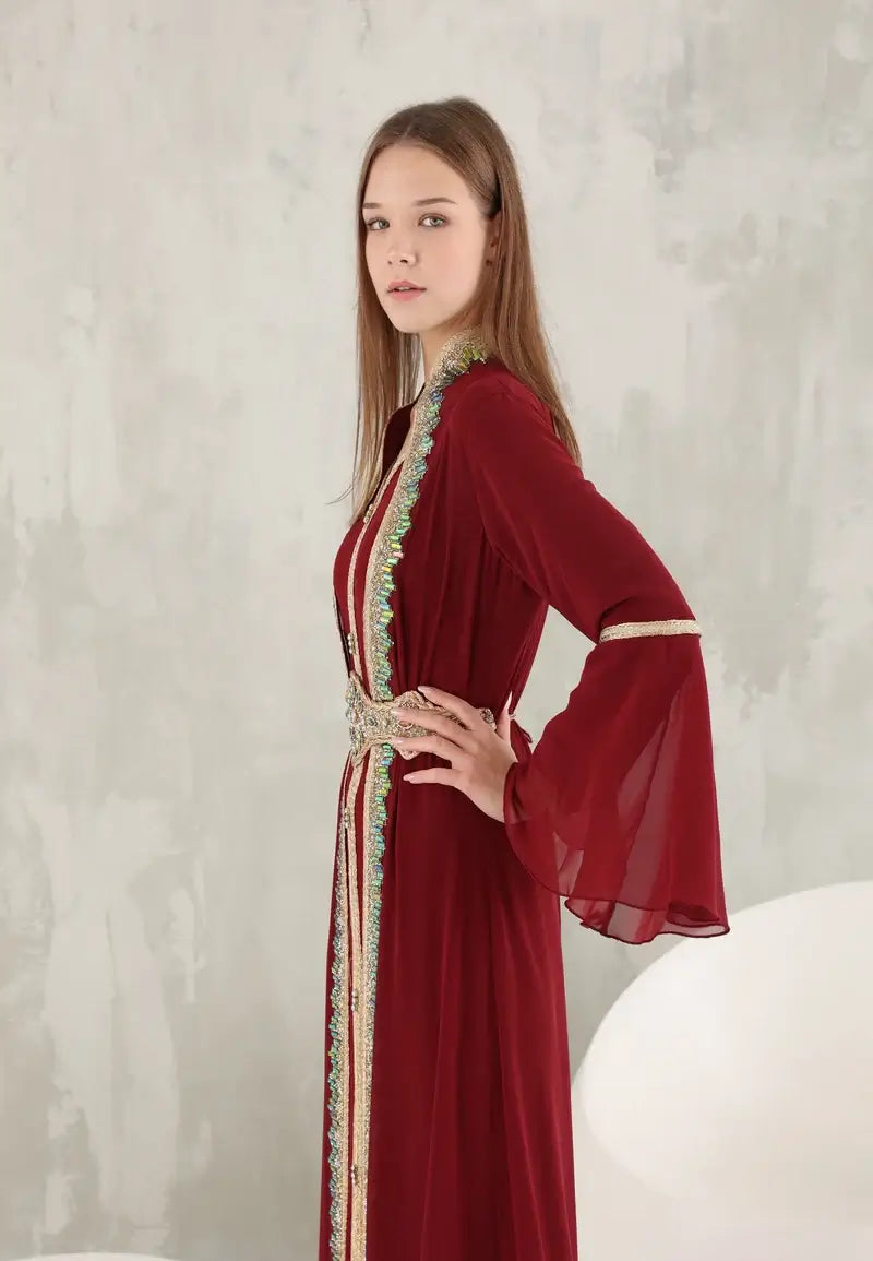 Dark red Moroccan women's caftan decorated with shiny colored crystals