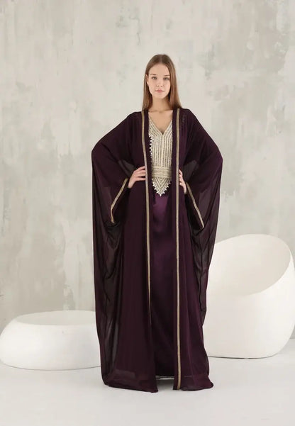 An ornate Moroccan Caftan with gold details and colourful stones