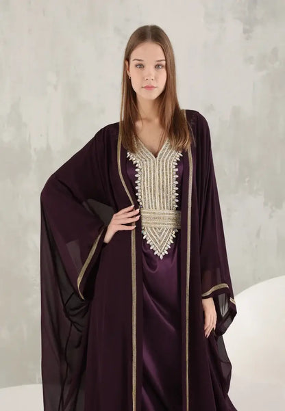An ornate Moroccan Caftan with gold details and colourful stones