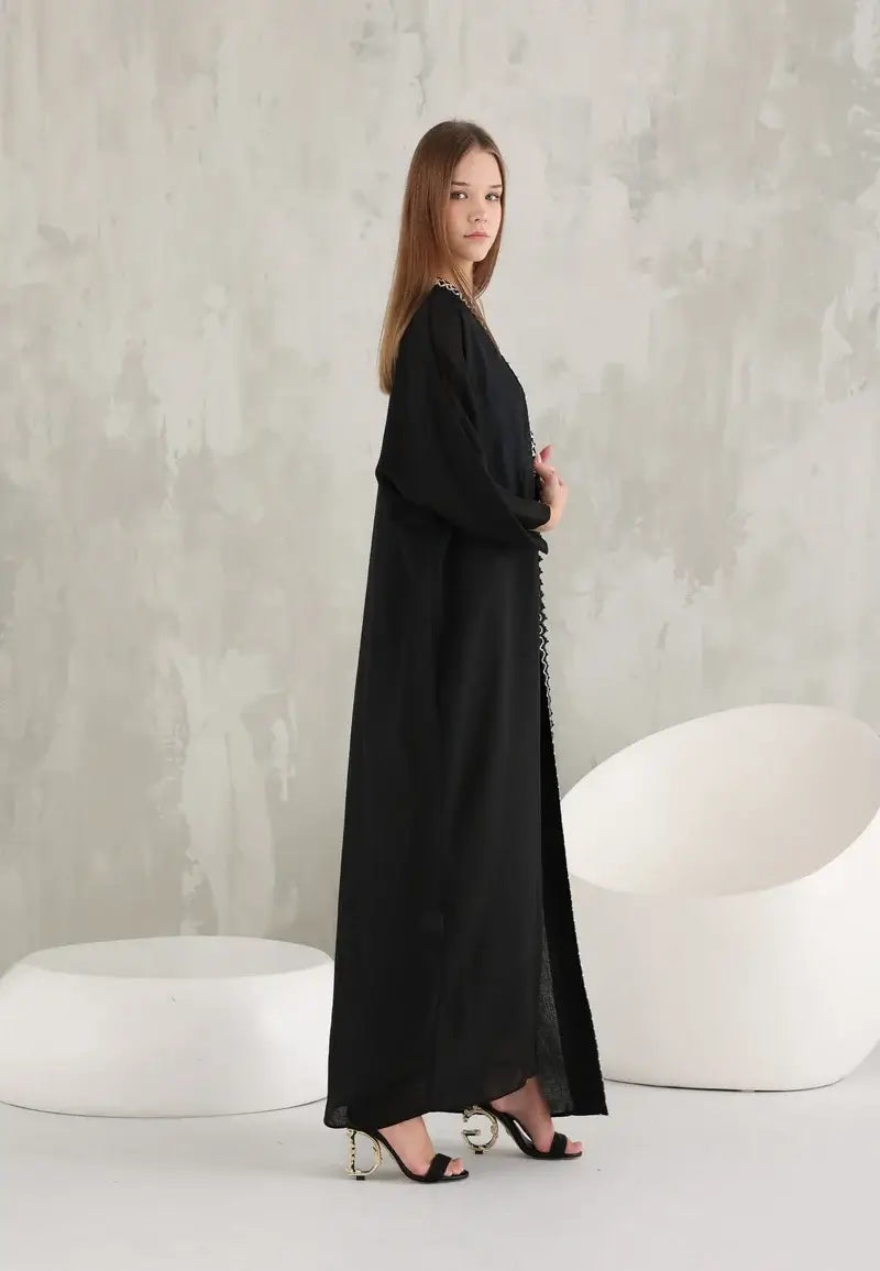 Black women's abaya with simple details and thin white threads