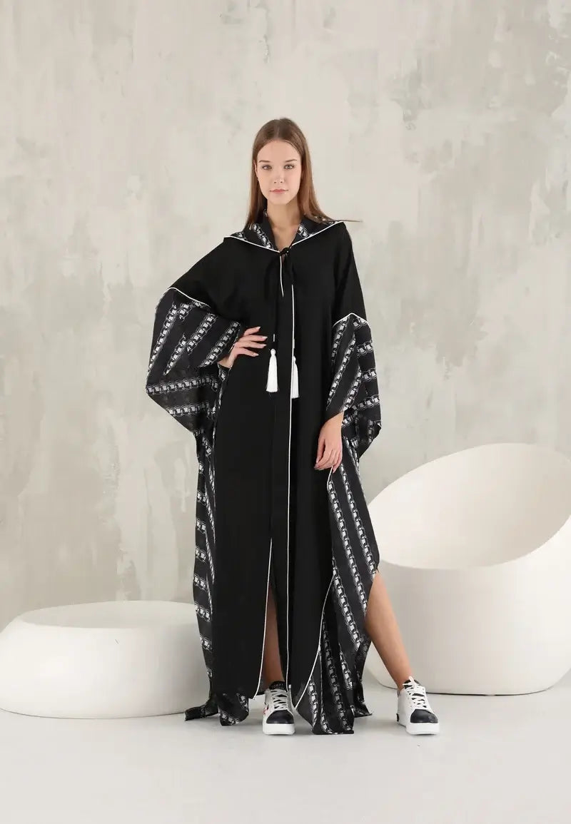 Black women's wide abaya with white threads and a hat