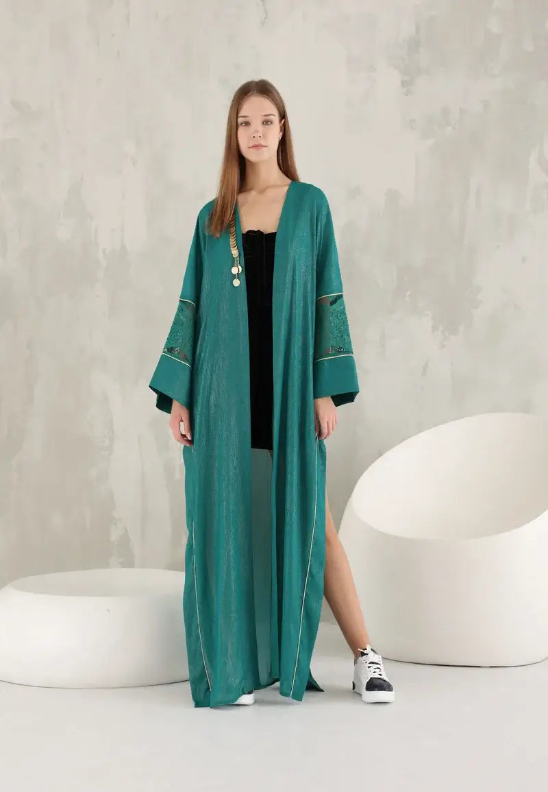 Elegant green shiny women's abaya with golden details