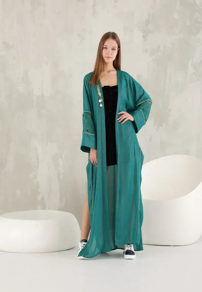 Elegant green shiny women's abaya with golden details
