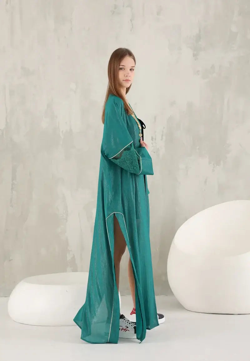Elegant green shiny women's abaya with golden details