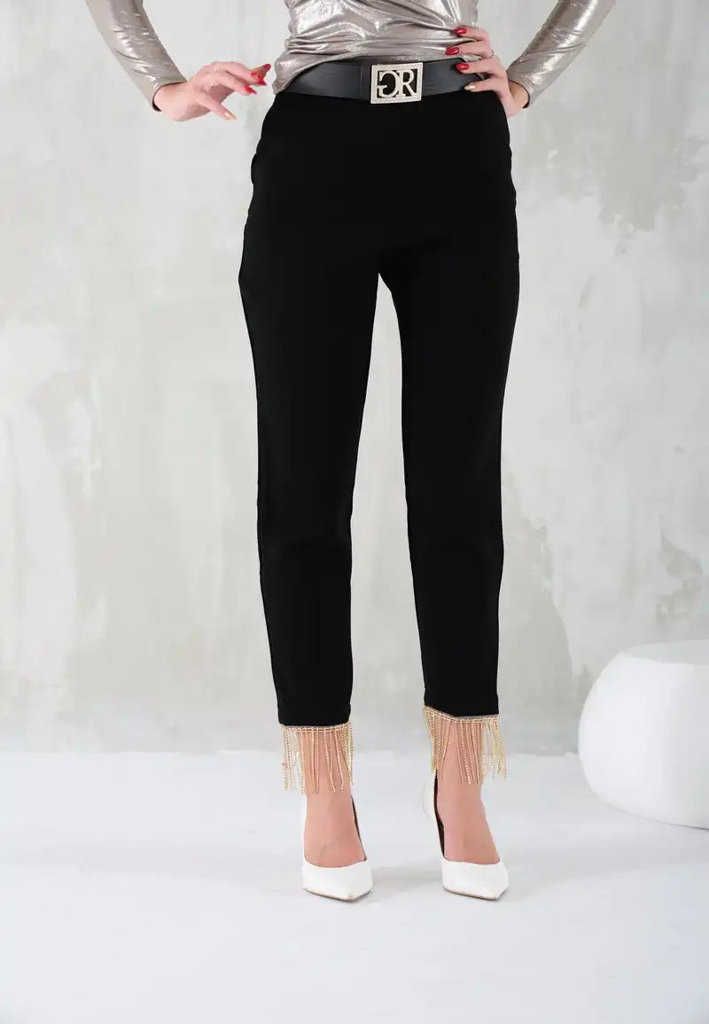 Black women's pants with gold chains at the bottom