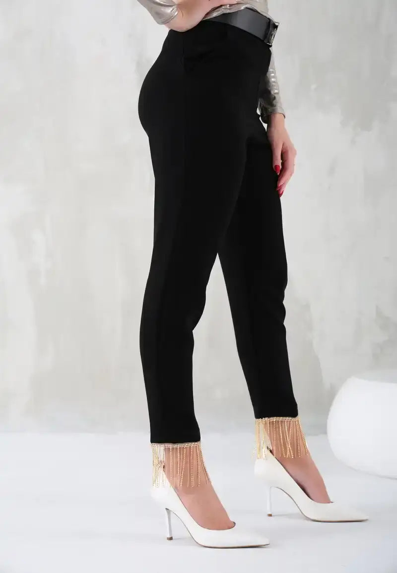 Black women's pants with gold chains at the bottom