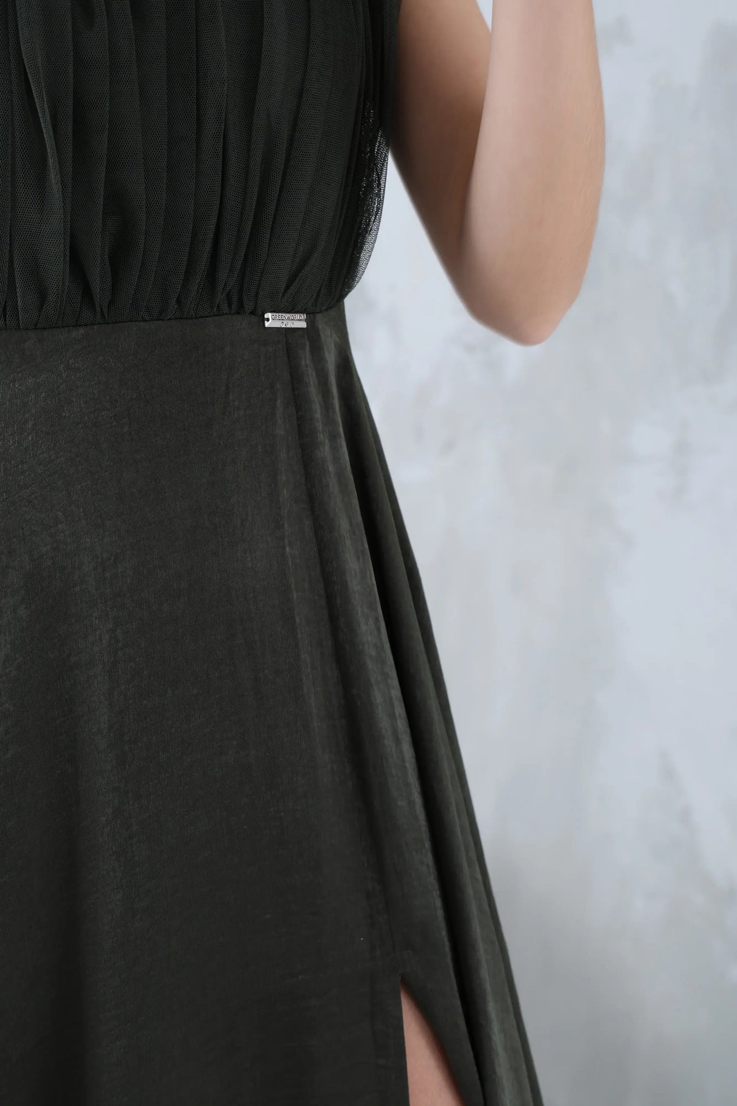 Long olive green sleeveless dress with a round neck