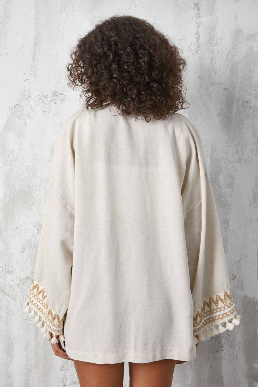 Women's open jacket with patterns on the sleeves