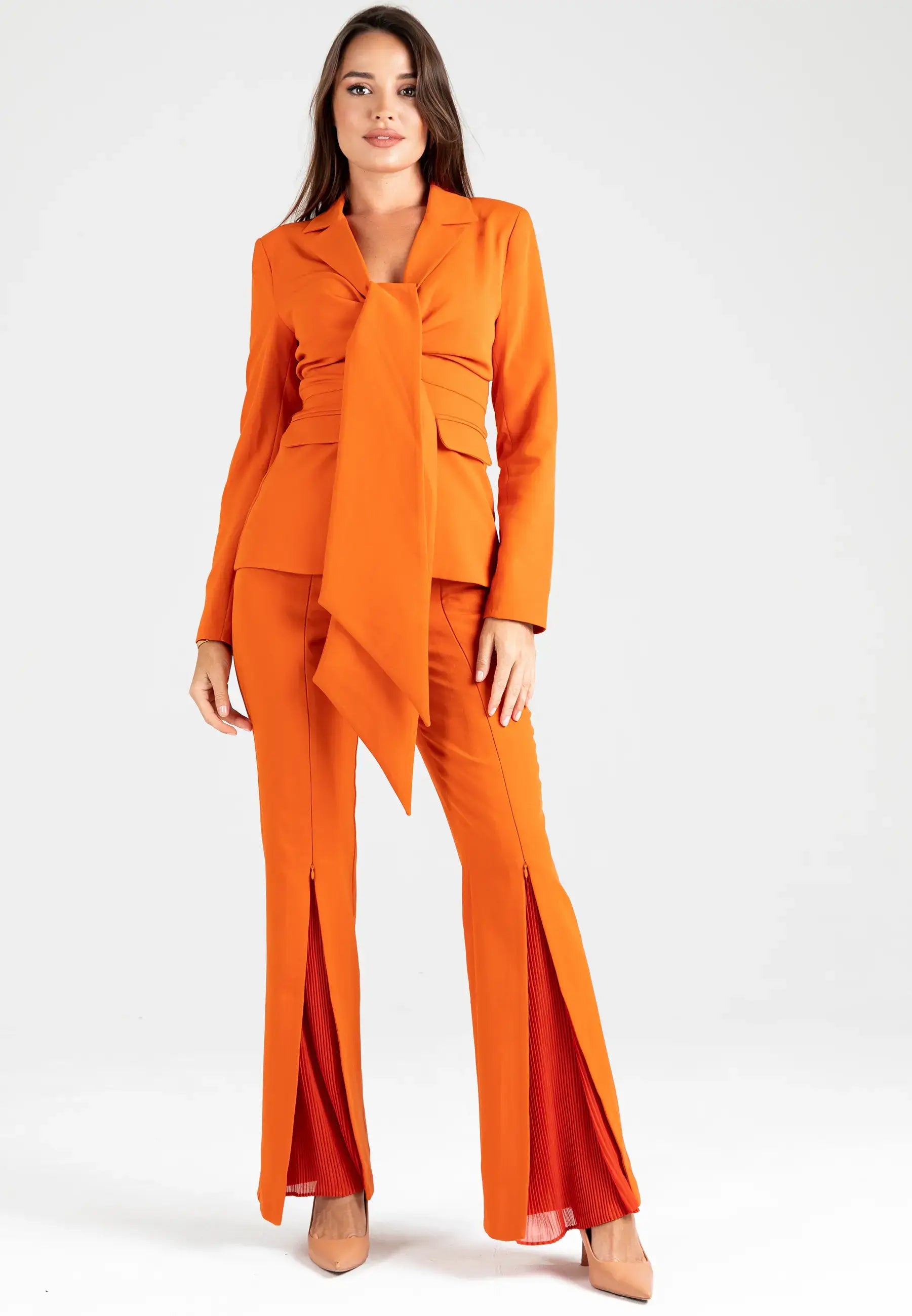 Women's suit consisting of a jacket with a knot and open pants from the bottom