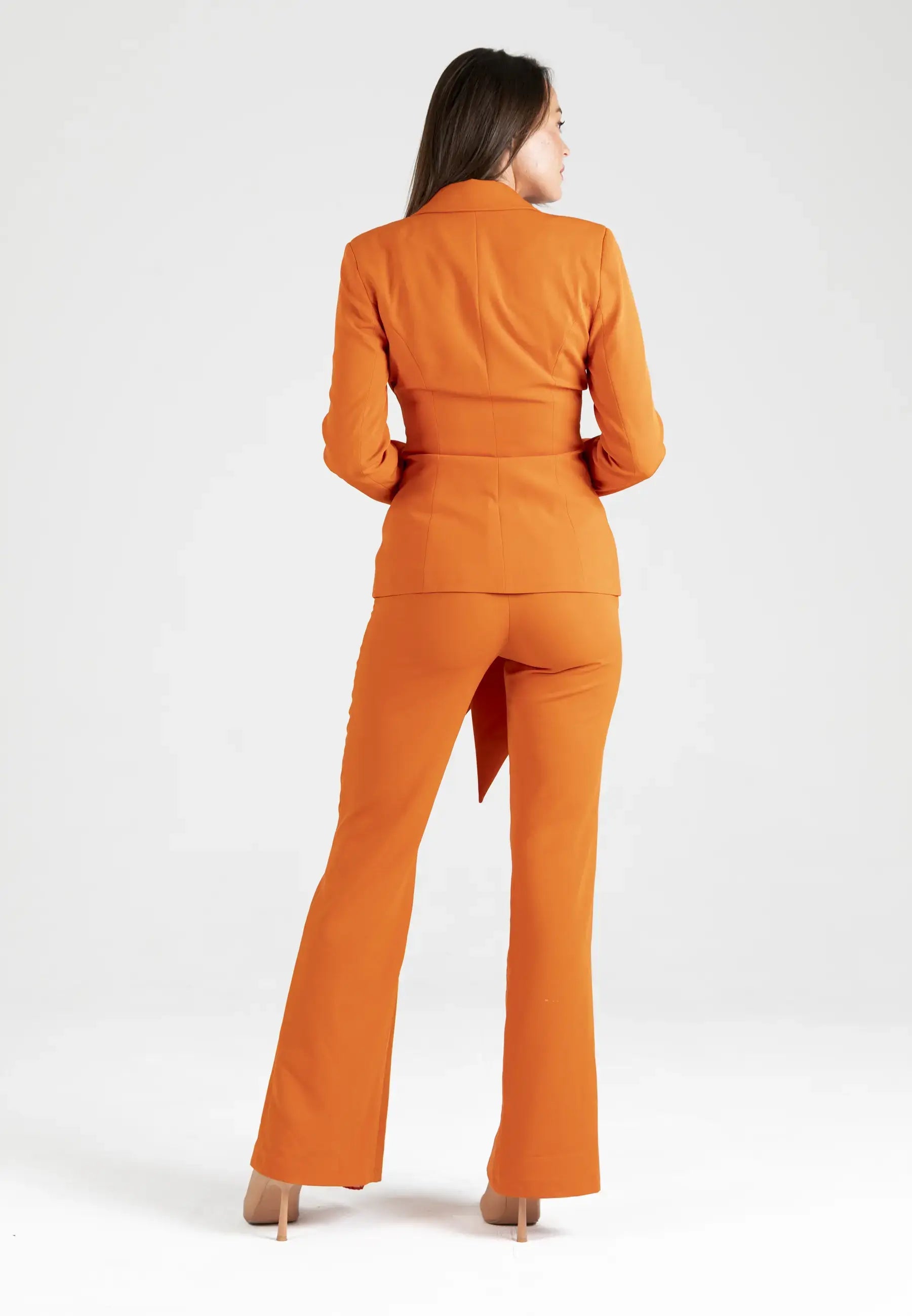 Women's suit consisting of a jacket with a knot and open pants from the bottom