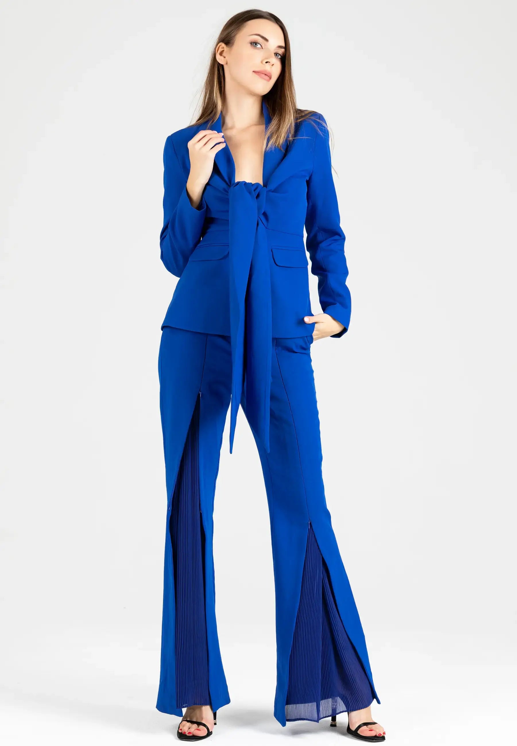 Women's suit consisting of a jacket with a knot and open pants from the bottom