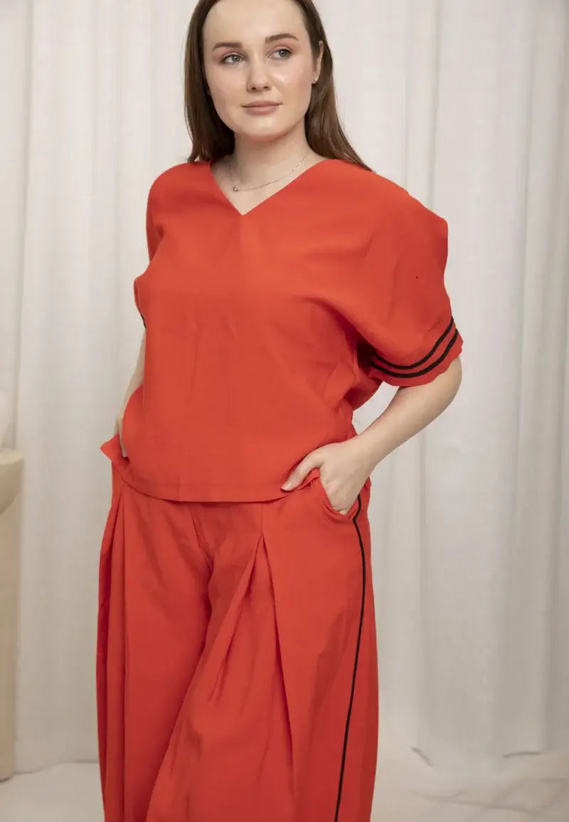 Casual women's set consisting of a loose T-shirt and tight pants at the bottom