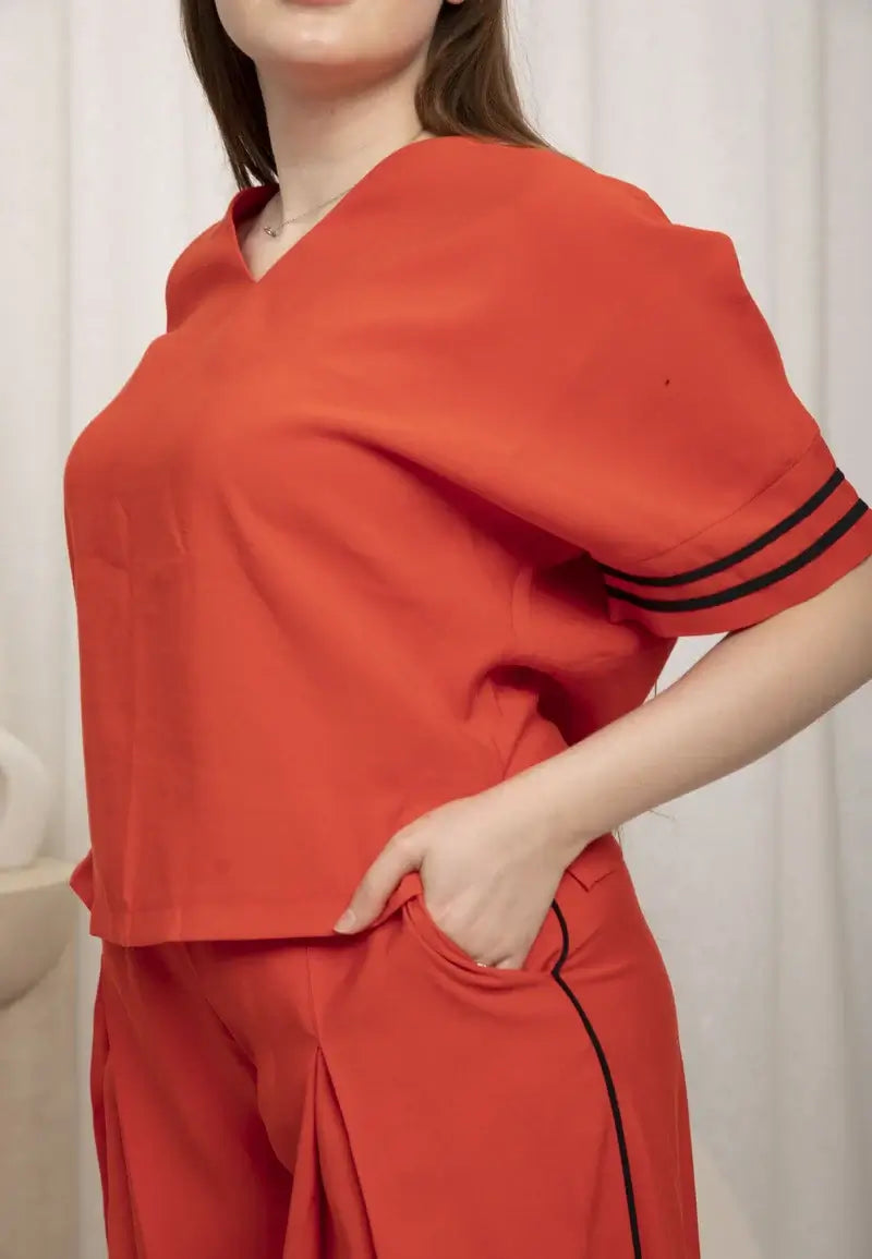 Casual women's set consisting of a loose T-shirt and tight pants at the bottom