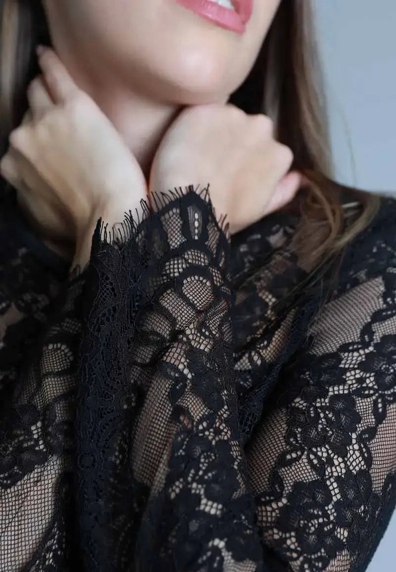 Long black dress with soft and transparent embroidery on the top