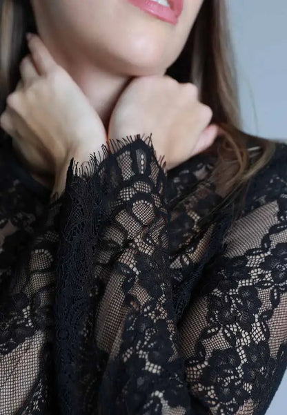 Long black dress with soft and transparent embroidery on the top
