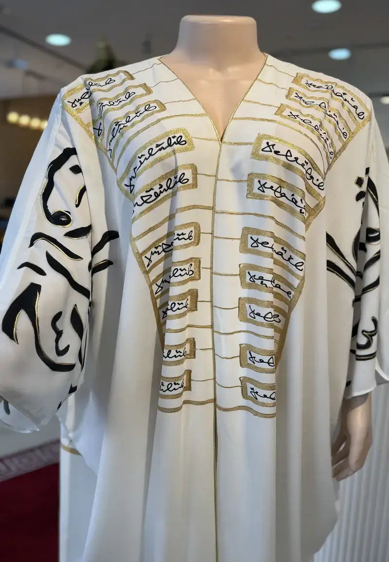 Luxurious black and white abaya embroidered with golden letters